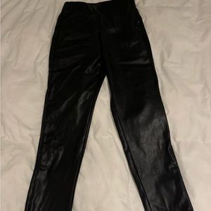 Never worn, faux leather pants with zipper at the ankle